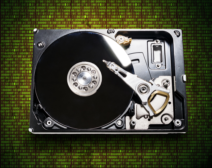 the hard drive from the computer in the background of the digits of the matrix