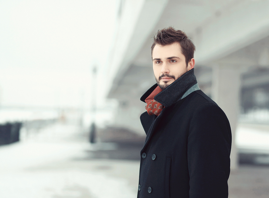 Smartly dressed man waiting for the train