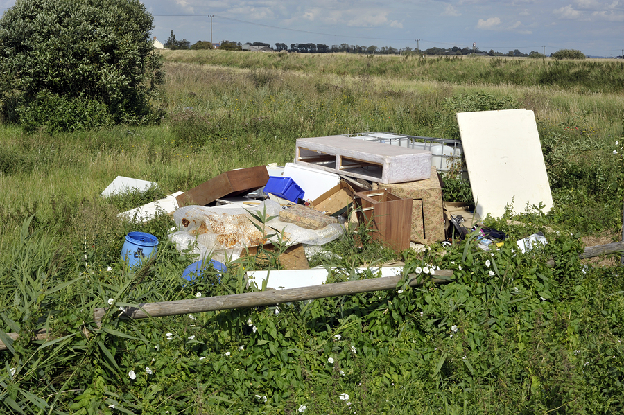 Fly-tipped household furniture clearance and industrial waste dumped in the countryside.