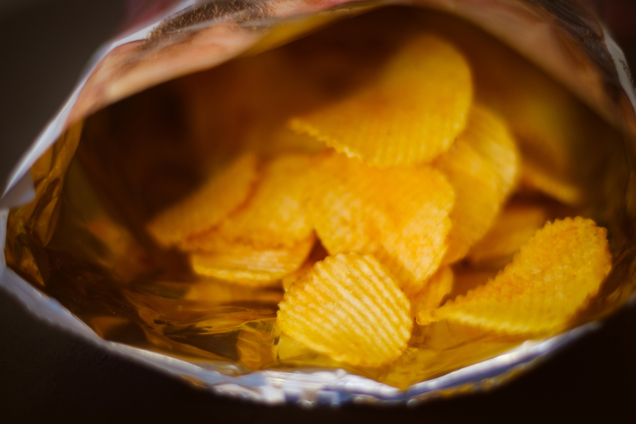 potato chips. delicious beer chaser. best food for quick snack. crunchy spicy crisps in a bag