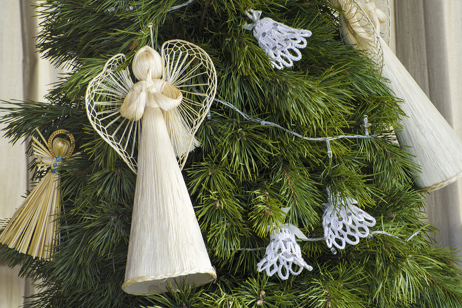 LVOV, UKRAINE- JANUARY 20, 2018: Straw Christmas angels on the Christmas tree. Christmas decorations